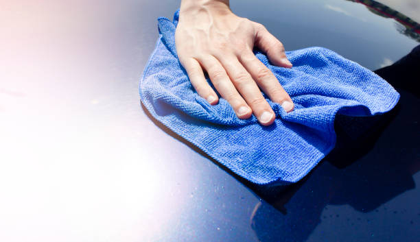 istock A man wipes a car with a microfiber cloth. Car polishing. 1502419069