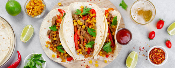 istock Mexican Tacos with Beef and Vegetables, Tacos al Pastor on Grey Background 1502419149