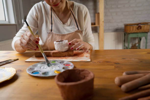 istock Woman painting a pottery 1502419510