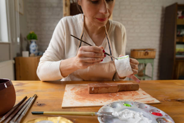 istock Woman painting a pottery 1502420620