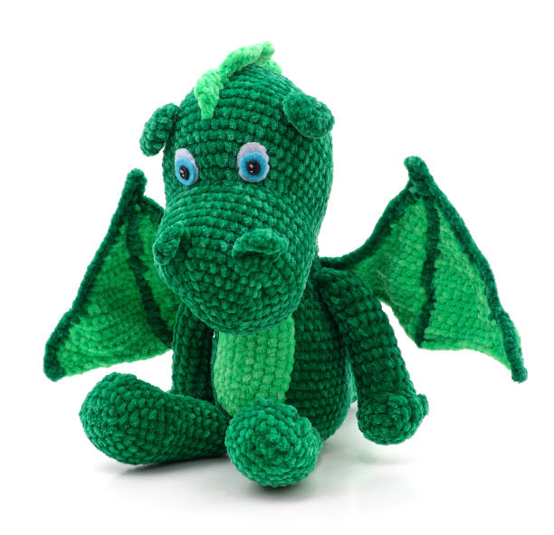 istock Green knitted dragon toy. 1502422029
