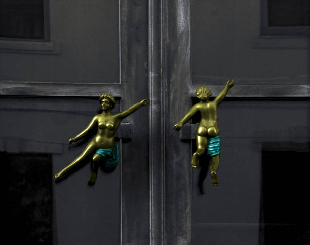 istock tiny nude female figures at the door 1502423116