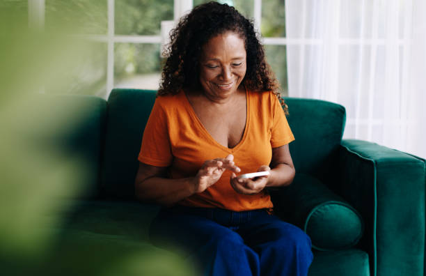 istock Mature woman using a mobile app to plan and manager her senior lifestyle 1502423329