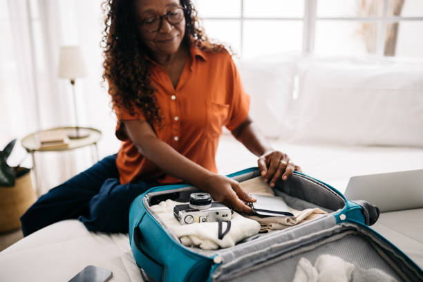 istock Senior woman packing her travel documents for a global adventure 1502423421