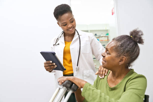 istock Female doctor talking with senior women 1502425115