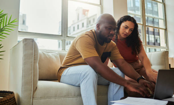 istock Young interracial couple working on their budget from home 1502425155