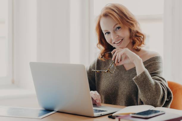 istock Scientist researches, prepares for test in cozy coworking, uses laptop, modern technologies for coursework, information search. 1502425939