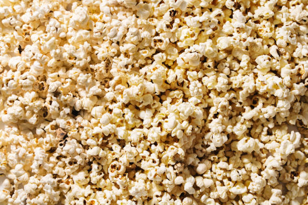 istock Closeup of scattered popcorn with hard lighting 1502426150