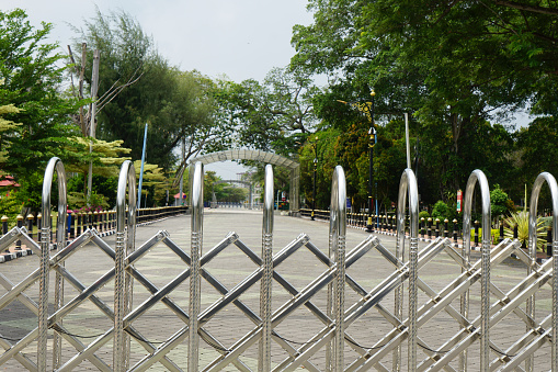 Close up of a moveable aluminium gate at a park at Tanjung Emas, Muar, Johor, Malaysia