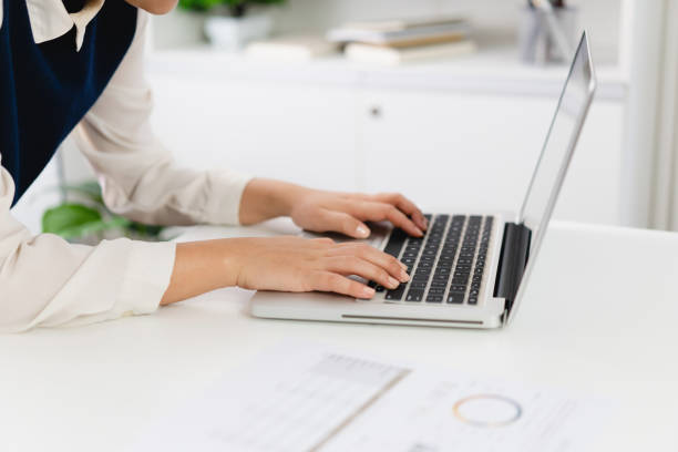 istock Business Professional Accountant Woman working on laptop computer making research for planning startup at desktop working process in office 1502429573