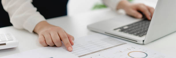 istock Business Professional Accountant Woman working on laptop computer making research for planning startup at desktop working process in office 1502429583