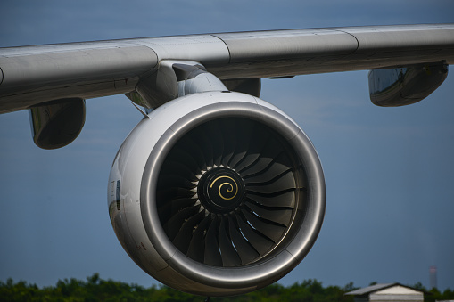 Airplane engine of commercial aircraft standing at airport