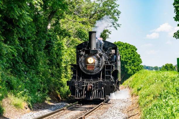 istock Train traveling along railroad tracks 1502432057