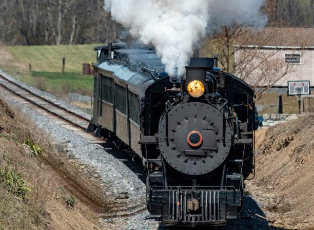 istock Train traveling along railroad tracks 1502432061