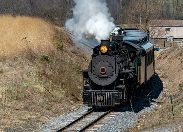 istock Train traveling along railroad tracks 1502432062
