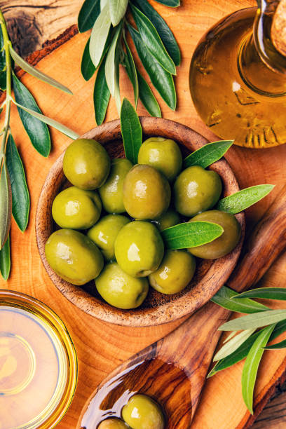 istock Wooden bowl with green olives 1502432199