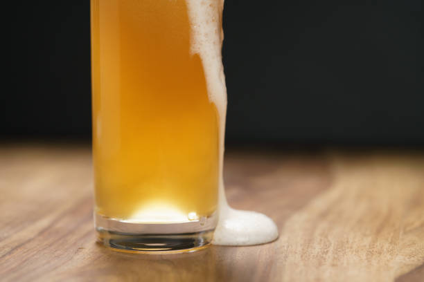 istock wheat unfiltered beer poured into glass on wood board 1502433800