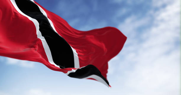 Close-up view of Trinidad and Tobago national flag waving Detail of Trinidad and Tobago national flag waving. The Republic of Trinidad and Tobago is an island state in the Caribbean. 3d illustration render. Rippled fabric. Selective focus. Close-up trinidad culture stock pictures, royalty-free photos & images