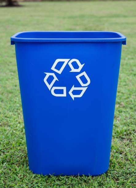 istock Blue trash can placed on a grassy outdoor 1502434089