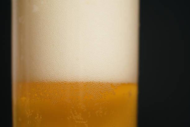 istock wheat unfiltered beer poured into glass over dark background 1502435937