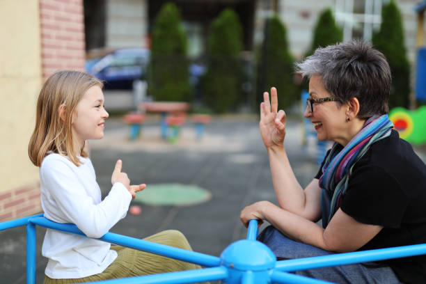 istock The process of communication between an adult and a child using sign language. 1502436306