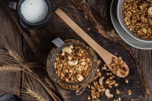 istock Granola with nuts, raisins and pumpkin seeds in a glass jar 1502442302
