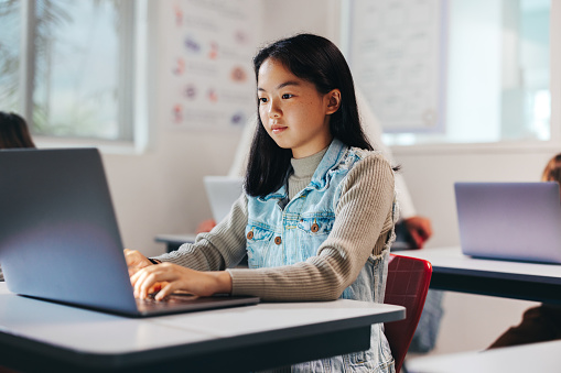 Exploring The Digital World Girl Programming On A Laptop In A Coding ...