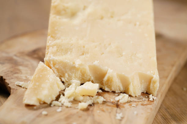 istock pieces of hard parmesan cheese on olive board 1502443708