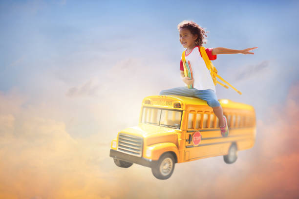 istock Child going back to school. Boy on school bus. 1502450180