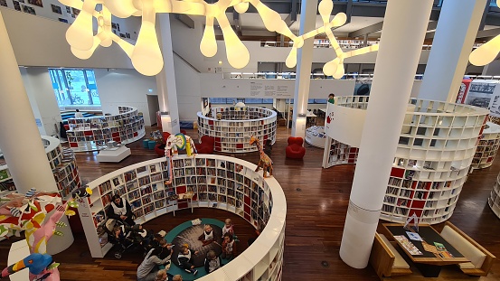 Interior of a large modern library with bookshelves.Waterloo University,Canada