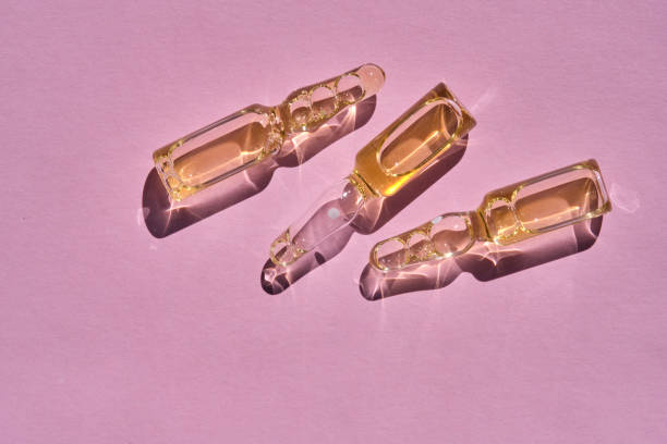 istock Ampoules on a pink background on the sun. 1502454959