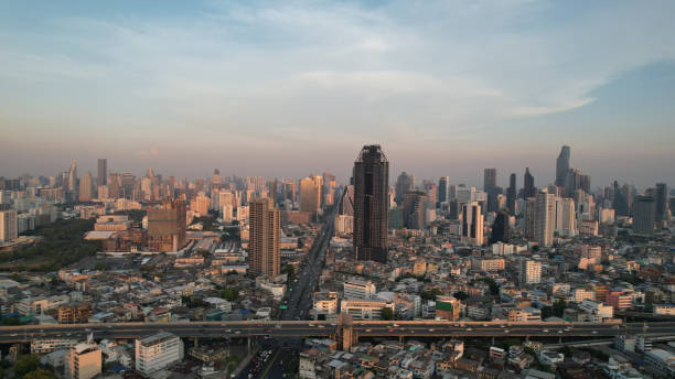 istock Panoramic Bangkok skyline view, concrete observatory deck on rooftop, daytime. Luxury Asian corporate and residential lifestyle. Aerial view of the office building with transport road in Bangkok Thailand. 1502455615
