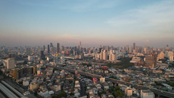 istock Panoramic Bangkok skyline view, concrete observatory deck on rooftop, daytime. Luxury Asian corporate and residential lifestyle. Aerial view of the office building with transport road in Bangkok Thailand. 1502455623