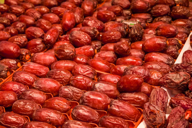 istock Date Fruits in row, semi dried. 1502457291