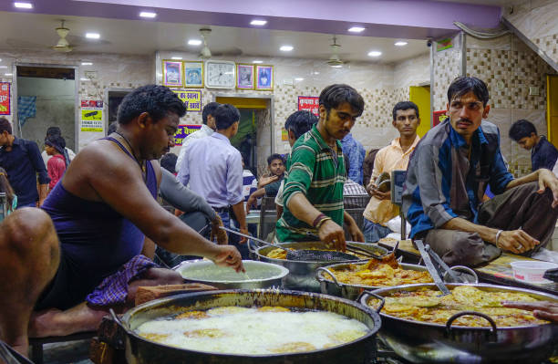 Varanasi, India - Nov 4, 2017. Indian street food vendors near the holy Ganges river. According to legends, Varanasi city was founded by God Shiva about 5000 years ago.