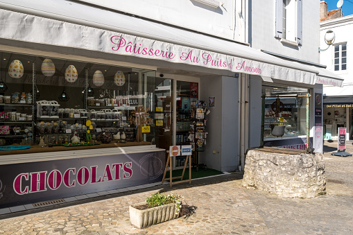 SAINT-PIERRE-D’OLERON, FRANCE  - April 19 2023. The Au Puits d'Amour patisserie is renowned on the island of Oléron for its original cake of the same name