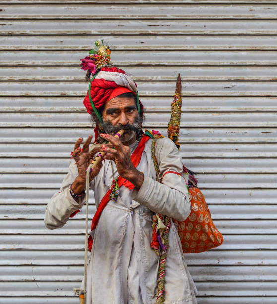 Pushkar, India - Nov 5, 2017. Musician playing traditional Rajasthani music on the street in Pushkar, India.