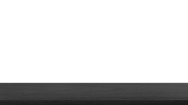 istock empty dark black wooden table top in foreground isolated on background with clipping path. counter bar foreground can be used for display or montage products. 1502458585