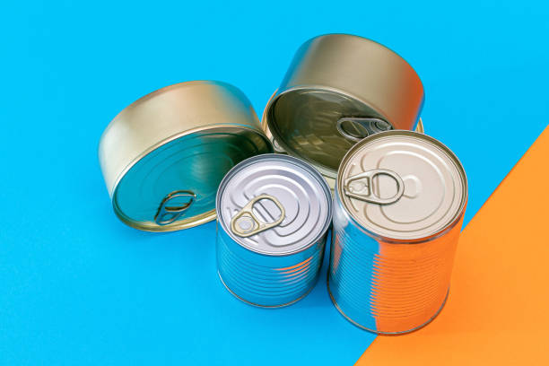 istock A Group of Stacked Tin Cans with Blank Edges on Split Blue and Orange Background 1502459168