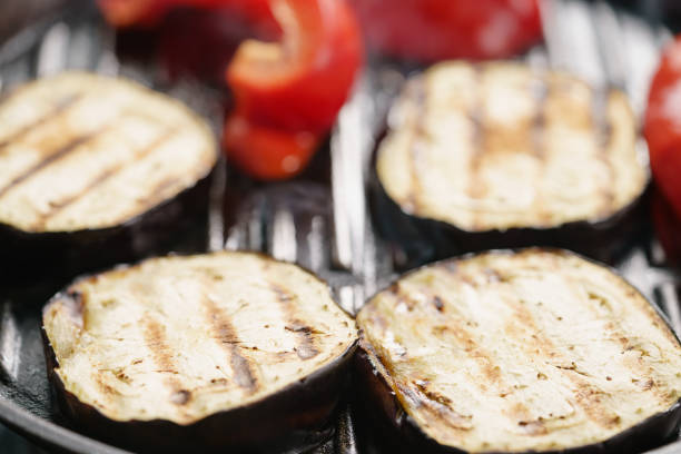 istock cooking eggplant and pepper on grill pan 1502466455
