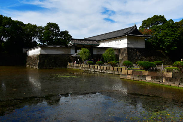Chiyoda, Tokyo, Japan:  Otemon Gate reflected on the Kikyō-bori moat, seen from  Uchibori-dori Street, Chiyoda ward.