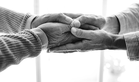 Old people holding hands close up view, senior retired family couple express care as psychological support concept, trust in happy marriage, empathy hope