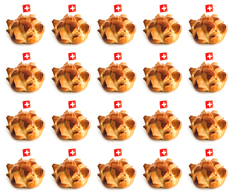 Swiss national holiday celebrated annually in Switzerland on August 1st with traditional bread called in German Augustweggen. Isolated on white, seamless pattern.