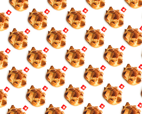 Swiss national holiday celebrated annually in Switzerland on August 1st with traditional bread called in German Augustweggen. Isolated on white, seamless pattern.