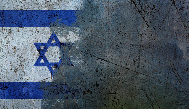 Ominous times for Israel: national flag being erased from a scratched grungey concrete wall, with copy space stock photo
