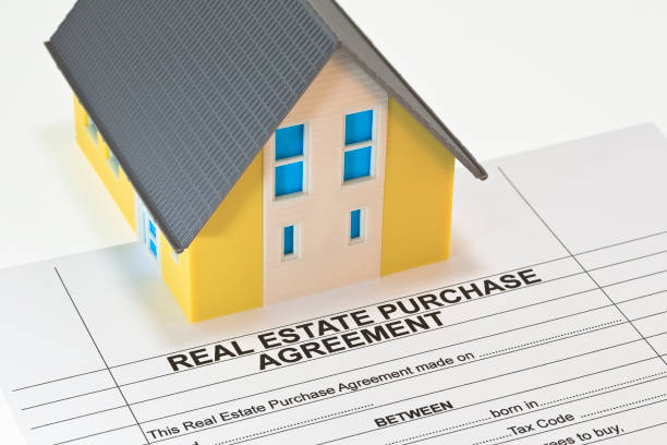 istock Real Estate Purchase Agreement concept with residential home model 1502516175