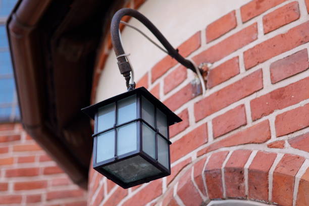 istock Metal black lantern and brick wall 1502523300