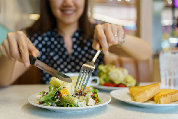 istock Woman enjoy eating salad. 1502523634