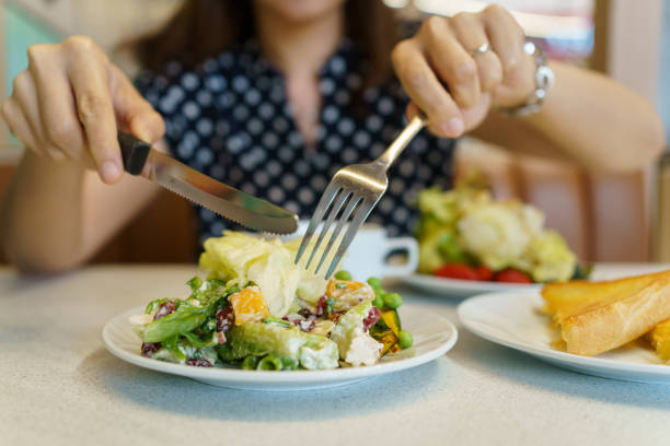 istock Woman enjoy eating salad. 1502523639