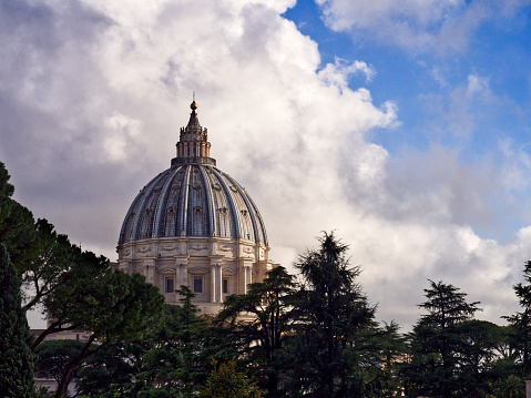 Saint Peter’s Basilica dome at cloudy spring afternoon. Vatican City. Rome, Italy